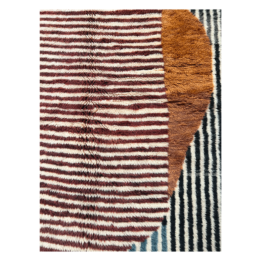 Elevate your space with the Modern Mrirt Moroccan Wool Rug. Featuring a contemporary design of solid color lines and abstract half circles in Blue, Black, Deep Brown, Maroon, and Cream, this handcrafted rug exudes luxury. Perfect for modern and eclectic styles. Shop now for an ultra-luxe addition to your home.