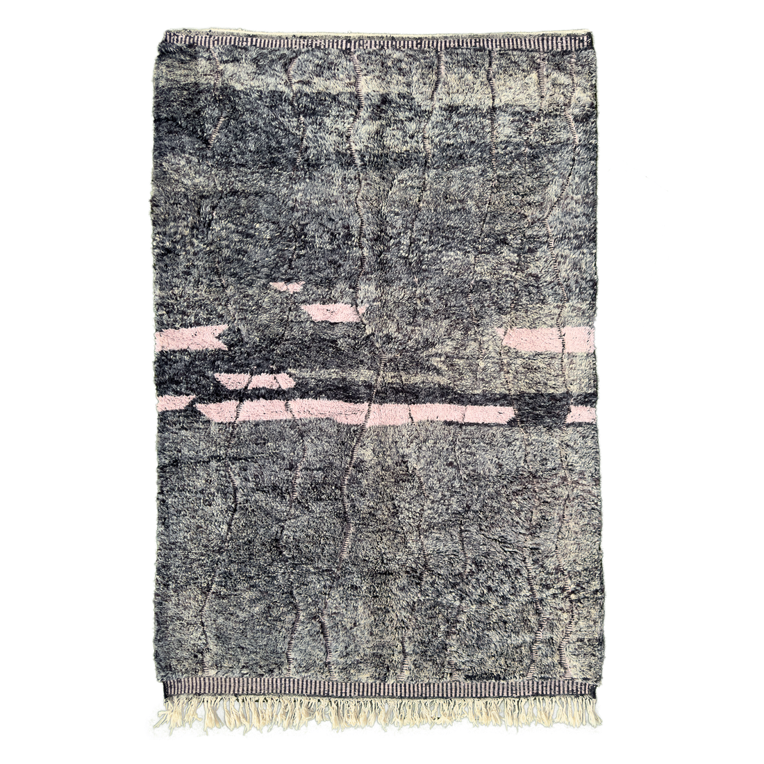 The rug features a unique blend of abrash shades of black and grey, creating a visually striking pattern that can withstand heavy foot traffic areas. The engraved flatweave linework adds a distinctive touch, while the majority of the rug boasts a luxuriously high pile wool at 1.25”.